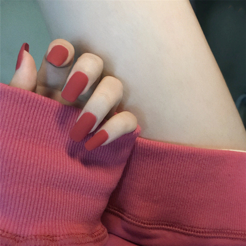 Matte Red manicure with false nails